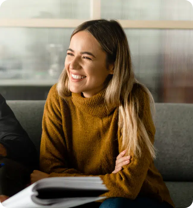 Apply your business rules, woman sat in a relaxed meeting.